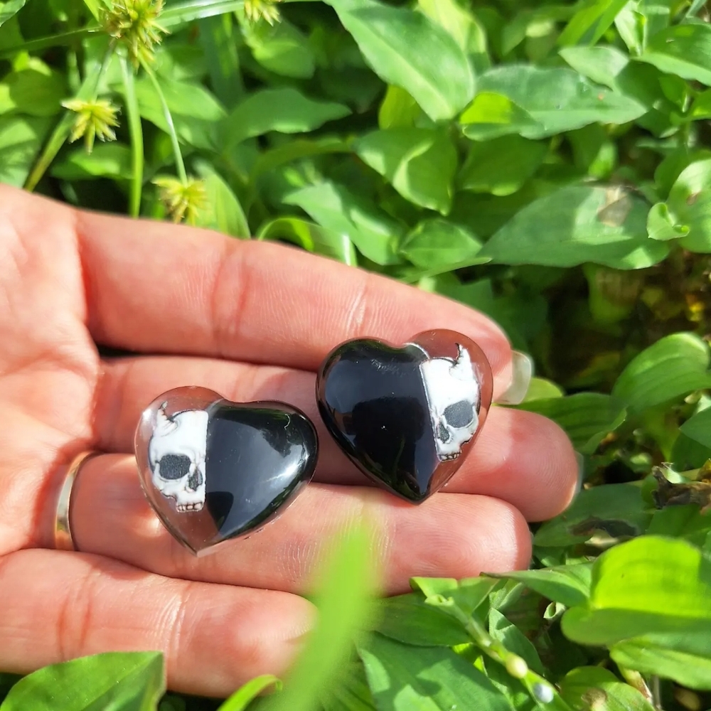 Handmade earrings inspired by Halloween 🎃 their heart shape and skull drawing